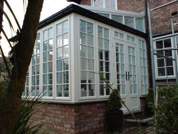 Mr & Mrs F. : Hoylake Wirral : Design and Build conservatory. Evolution Storm Whitewood PvcU doors and window. White wood Aluminium reinforced roof 